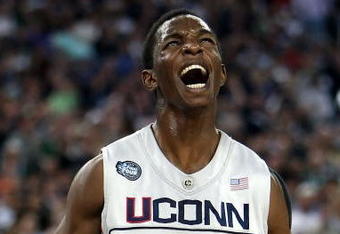 DETROIT - APRIL 04:  Hasheem Thabeet #34 of the Connecticut Huskies reacts after he scored a basket in the first half against the Michigan State Spartans during the National Semifinal game of the NCAA Division I Men's Basketball Championship at Ford Field on April 4, 2009 in Detroit, Michigan.  (Photo by Gregory Shamus/Getty Images)