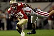 ORLANDO, FL - DECEMBER 27:  Bert Reed #83 of the Florida State Seminoles breaks the tackle of Chris Maragos #21 of the Wisconsin Badgers during the Champs Bowl on December 27, 2008 at the Citrus Bowl in Orlando, Florida.  (Photo by Sam Greenwood/Getty Images)