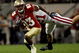 ORLANDO, FL - DECEMBER 27: Bert Reed #83 of the Florida State Seminoles breaks the tackle of Chris Maragos #21 of the Wisconsin Badgers during the Champs Bowl on December 27, 2008 at the Citrus Bowl in Orlando, Florida. (Photo by Sam Greenwood/Getty Images)