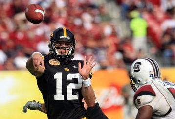 TAMPA, FL - JANUARY 01:  Ricky Stanzi #12 of the Iowa Hawkeyes drops back to pass against the South Carolina Gamecocks during the Outback Bowl on January 1, 2009 at Raymond James Stadium in Tampa, Florida.  (Photo by Scott Halleran/Getty Images)