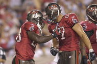 TAMPA, FL - AUGUST 30:  Running back Lionel Gates #28 and and tight end Keith Heinrich #87 of the Tampa Bay Buccaneers celebrate a touchdown against the Houston Texans in a pre-season game at Raymond James Stadium on August 30, 2007 in Tampa, Florida.  The Bucs won 31-24. (Photo by Al Messerschmidt/Getty Images)