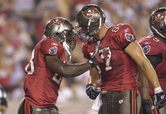 TAMPA, FL - AUGUST 30:  Running back Lionel Gates #28 and and tight end Keith Heinrich #87 of the Tampa Bay Buccaneers celebrate a touchdown against the Houston Texans in a pre-season game at Raymond James Stadium on August 30, 2007 in Tampa, Florida.  The Bucs won 31-24. (Photo by Al Messerschmidt/Getty Images)