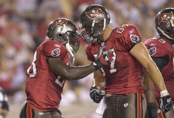 TAMPA, FL - AUGUST 30:  Running back Lionel Gates #28 and and tight end Keith Heinrich #87 of the Tampa Bay Buccaneers celebrate a touchdown against the Houston Texans in a pre-season game at Raymond James Stadium on August 30, 2007 in Tampa, Florida.  The Bucs won 31-24. (Photo by Al Messerschmidt/Getty Images)