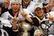 DETROIT - JUNE 12:  The Pittsburgh Penguins celebrate with the Stanley Cup after defeating the Detroit Red Wings by a score of 2-1 to win Game Seven and the 2009 NHL Stanley Cup Finals at Joe Louis Arena on June 12, 2009 in Detroit, Michigan.  (Photo by Jim McIsaac/Getty Images)