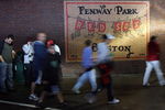 BOSTON - SEPTEMBER 27:  Fans leave the stadium after the the Boston Red Sox versus the New York Yankees was postponed due to rain on September 27, 2008 at Fenway Park in Boston, Massachusetts.  (Photo by Elsa/Getty Images)