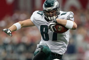 GLENDALE, AZ - JANUARY 18:  Tight end Brent Celek #87 of the Philadelphia Eagles jumps over cornerback Ralph Brown #20 of the Arizona Cardinals in the second quarter of the NFC championship game on January 18, 2009 at University of Phoenix Stadium in Glendale, Arizona.  (Photo by Jed Jacobsohn/Getty Images)