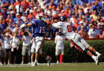 GAINESVILLE, FL - SEPTEMBER 27:  Quarterback Tim Tebow #15 of the Florida Gators is pressured by Greg Hardy #86 of the Ole Miss Rebels during the game at Ben Hill Griffin Stadium on September 27, 2008 in Gainesville, Florida.  (Photo by Sam Greenwood/Getty Images)