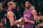 23 Apr 2000: Vince Carter #15 of the Toronto Raptors shakes hands with teammate Tracy McGrady #1 during round one of the NBA Playoffs against the New York Knicks at the Madison Square Garden in New York. The Knicks defeated the Raptors 92-88.   Mandatory Credit: Ezra O. Shaw  /Allsport