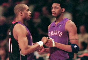 23 Apr 2000: Vince Carter #15 of the Toronto Raptors shakes hands with teammate Tracy McGrady #1 during round one of the NBA Playoffs against the New York Knicks at the Madison Square Garden in New York. The Knicks defeated the Raptors 92-88.   Mandatory Credit: Ezra O. Shaw  /Allsport