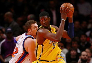 NEW YORK - FEBRUARY 23:  Roy Hibbert #55 of the Indiana Pacers goes up against David Lee #42 of the New York Knicks during the game at Madison Square Garden February 23, 2009 in New York City.  The Knicks won 123-119.  NOTE TO USER: User expressly acknowledges and agrees that, by downloading and/or using this Photograph, User is consenting to the terms and conditions of the Getty Images License Agreement.  (Photo by Chris McGrath/Getty Images)