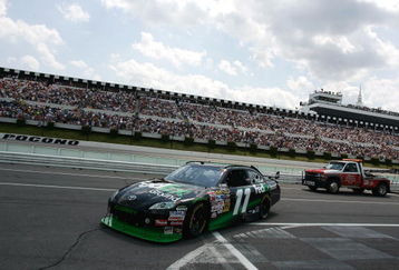 LONG POND, PA - JUNE 07: Denny Hamlin drives the #11 FedEx Ground Toyota into the garage after experiencing mechanical issues during the NASCAR Sprint Cup Series Pocono 500 on June 7, 2009 at Pocono Raceway in Long Pond, Pennsylvania.  (Photo by Jason Smith/Getty Images)