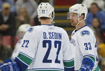 DETROIT - JANUARY 17:  The Sedin brothers Daniel #22 and Henrik #33 of the Vancouver Canucks chat prior to a faceoff in a game against the Detroit Red Wings on January 17, 2008 at the Joe Louis Arena in Detroit, Michigan. The Wings defeated the Canucks 3-2 in a shootout. (Photo by Claus Andersen/Getty Images)