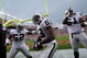 DENVER - SEPTEMBER 16: Thomas Howard #53 of the Oakland Raiders celebrates his interception for a touchdown with Kirk Morrison #52 and Gerard Warren #61 against the Denver Broncos as the Broncos defeated the Raiders 23-20 in overtime during week two NFL action at Invesco Field at Mile High on September 16, 2007 in Denver, Colorado. (Photo by Doug Pensinger/Getty Images)