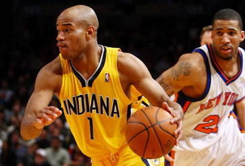 NEW YORK - FEBRUARY 23:  Jarrett Jack #1 of the Indiana Pacers drives to the basket past Wilson Chandler #21 of the New York Knicks during the game at Madison Square Garden February 23, 2009 in New York City.  The Knicks won 123-119.  NOTE TO USER: User expressly acknowledges and agrees that, by downloading and/or using this Photograph, User is consenting to the terms and conditions of the Getty Images License Agreement.  (Photo by Chris McGrath/Getty Images)
