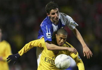BLACKBURN, UNITED KINGDOM - FEBRUARY 28: Gael Clichy of Arsenal tangles with Matt Derbyshire of Blackburn Rovers during the FA Cup sponsored by E.ON 5th Round Replay match between Blackburn Rovers and Arsenal at Ewood Park on February 28, 2007 in Blackburn, England. (Photo by Alex Livesey/Getty Images)