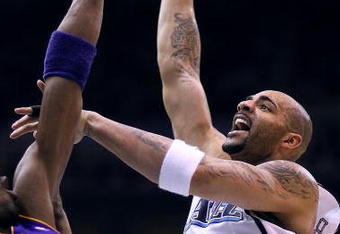 SALT LAKE CITY - APRIL 25:  Carlos Boozer #5 of the Utah Jazz shoots against Kobe Bryant #24 of the Los Angeles Lakers in Game Four of the Western Conference Quarterfinals during the 2009 NBA Playoffs at Energy Solutions Arena on April 25, 2009 in Salt Lake City, Utah. NOTE TO USER: User expressly acknowledges and agrees that, by downloading and/or using this Photograph, user is consenting to the terms and conditions of the Getty Images License Agreement. Mandatory Copyright Notice: Copyright 2009 Getty Images (Photo by Otto Greule Jr/Getty Images)