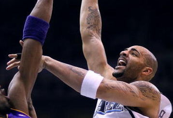 SALT LAKE CITY - APRIL 25:  Carlos Boozer #5 of the Utah Jazz shoots against Kobe Bryant #24 of the Los Angeles Lakers in Game Four of the Western Conference Quarterfinals during the 2009 NBA Playoffs at Energy Solutions Arena on April 25, 2009 in Salt Lake City, Utah. NOTE TO USER: User expressly acknowledges and agrees that, by downloading and/or using this Photograph, user is consenting to the terms and conditions of the Getty Images License Agreement. Mandatory Copyright Notice: Copyright 2009 Getty Images (Photo by Otto Greule Jr/Getty Images)