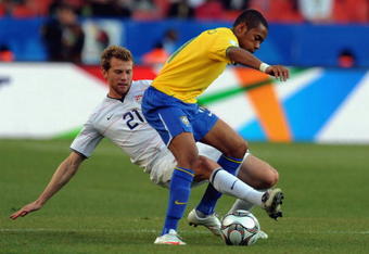 TSHWANE, SOUTH AFRICA - JUNE 18: Jonathan Spector of the USA competes for the ball with Robinho of Brazil during the FIFA Confederations Cup match between Brazil and USA at the Loftus Versveld Stadium on June 18, 2009 in Tshwane, South Africa. (Photo by Lefty Shivambu/Gallo Images/Getty Images)