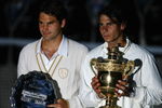 LONDON - JULY 06:  Rafael Nadal of Spain and Roger Federer of Switzerland pose for pictures with after Nadal won in five sets in the final on day thirteen of the Wimbledon Lawn Tennis Championships at the All England Lawn Tennis and Croquet Club on July 6, 2008 in London, England.  (Photo by Julian Finney/Getty Images)