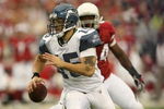 GLENDALE, AZ - DECEMBER 28:  Quarterback Seneca Wallace #15 of the Seattle Seahawks scrambles away from linebacker Gerald Hayes #54 of the Arizona Cardinals on December 28, 2008 at University of Phoenix Stadium in Glendale, Arizona.  (Photo by Stephen Dunn/Getty Images)