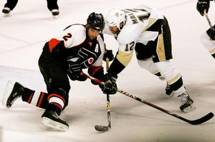 PHILADELPHIA - MAY 15:  Derian Hatcher #2 of the Philadelphia Flyers battles for the puck with Ryan Malone #12 of the Pittsburgh Penguins during the second period of game four of the Eastern Conference Finals of the 2008 NHL Stanley Cup Playoffs at Wachovia Center on May 15, 2008 in Philadelphia, Pennsylvania.  (Photo by Bruce Bennett/Getty Images)