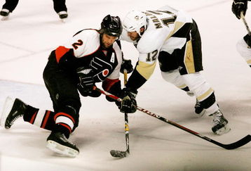 PHILADELPHIA - MAY 15:  Derian Hatcher #2 of the Philadelphia Flyers battles for the puck with Ryan Malone #12 of the Pittsburgh Penguins during the second period of game four of the Eastern Conference Finals of the 2008 NHL Stanley Cup Playoffs at Wachovia Center on May 15, 2008 in Philadelphia, Pennsylvania.  (Photo by Bruce Bennett/Getty Images)