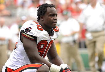 TAMPA, FL - SEPTEMBER 28: Defensive end Gaines Adams #90 of the Tampa Bay Buccaneers pauses during play against the Green Bay Packers at Raymond James Stadium on September 28, 2008 in Tampa, Florida.  (Photo by Al Messerschmidt/Getty Images) 