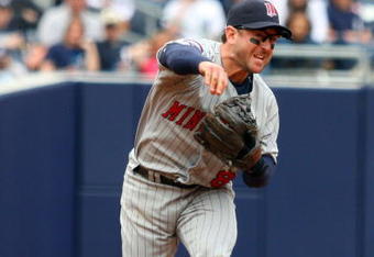 NEW YORK - MAY 17:  Nick Punto #8 of the Minnesota Twins throws against the New York Yankees on May 17, 2009 at Yankee Stadium in the Bronx borough of New York City. The Yankees defeated the Twins 3-2 in ten innings.  (Photo by Jim McIsaac/Getty Images)