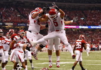 NEW ORLEANS - JANUARY 02:  Wide receiver Brent Casteel #5 of the Utah Utes reacts with teammate Zane Beadles after Casteel scores a six-yard touchdwon against the Alabama Crimson Tide during the first quarter of the 75th Allstate Sugar Bowl at the Louisiana Superdome on January 2, 2009 in New Orleans, Louisiana.  (Photo by Kevin C. Cox/Getty Images)