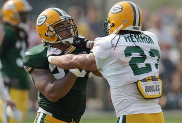 GREEN BAY, WI - AUGUST 6:  Noah Herron #23 of the Green Bay Packers blocks Nick Barnett #56 during summer training camp on August 6, 2007 at the Hutson Center in Green Bay, Wisconsin. (Photo by Jonathan Daniel/Getty Images)