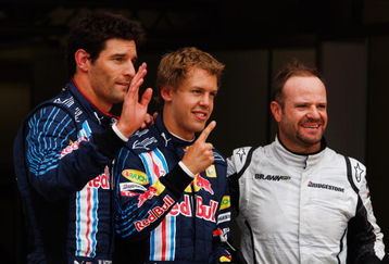 NORTHAMPTON, UNITED KINGDOM - JUNE 20:  Pole sitter Sebastian Vettel (C) of Germany and Red Bull Racing celebrates with second placed Rubens Barrichello (R) of Brazil and Brawn GP and third placed Mark Webber (L) of Australia and Red Bull Racing following qualifying for the British Formula One Grand Prix at Silverstone on June 20, 2009 in Northampton, England.  (Photo by Mark Thompson/Getty Images)