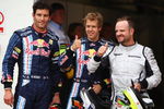 NORTHAMPTON, UNITED KINGDOM - JUNE 20:  Pole sitter Sebastian Vettel (C) of Germany and Red Bull Racing celebrates with second placed Rubens Barrichello (R) of Brazil and Brawn GP and third placed Mark Webber (L) of Australia and Red Bull Racing following qualifying for the British Formula One Grand Prix at Silverstone on June 20, 2009 in Northampton, England.  (Photo by Paul Gilham/Getty Images)