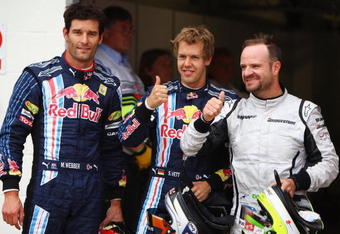 NORTHAMPTON, UNITED KINGDOM - JUNE 20:  Pole sitter Sebastian Vettel (C) of Germany and Red Bull Racing celebrates with second placed Rubens Barrichello (R) of Brazil and Brawn GP and third placed Mark Webber (L) of Australia and Red Bull Racing following qualifying for the British Formula One Grand Prix at Silverstone on June 20, 2009 in Northampton, England.  (Photo by Paul Gilham/Getty Images)