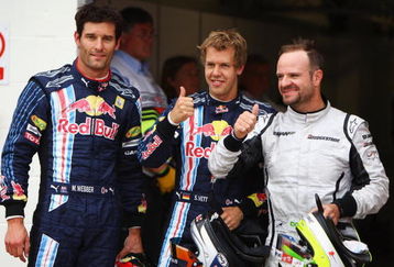 NORTHAMPTON, UNITED KINGDOM - JUNE 20:  Pole sitter Sebastian Vettel (C) of Germany and Red Bull Racing celebrates with second placed Rubens Barrichello (R) of Brazil and Brawn GP and third placed Mark Webber (L) of Australia and Red Bull Racing following qualifying for the British Formula One Grand Prix at Silverstone on June 20, 2009 in Northampton, England.  (Photo by Paul Gilham/Getty Images)