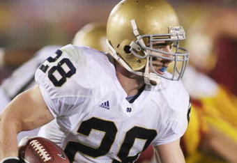 LOS ANGELES - NOVEMBER 29:  Kyle McCarthy #28 of the Notre Dame Fighting Irish returns an interception eight yards out of the endzone against the USC Trojans in the third quarter on November 29, 2008 at the Los Angeles Memorial Coliseum in Los Angeles, California.  USC won 38-3.  (Photo by Jeff Golden/Getty Images) 