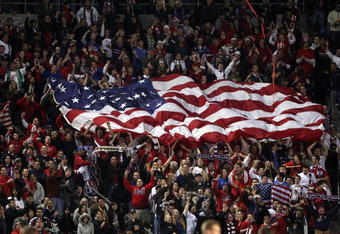 CARSON, CA - JANUARY 19:  Fans of the U.S. Men's National Team unfurl a flag of the USA in the stands during the international friendly against Sweden on January 19, 2008 at the Home Depot Center in Carson, California. USA defeated Sweden 2-0. (Photo by Stephen Dunn/Getty Images)