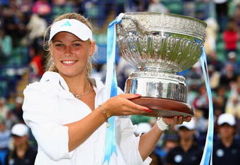 EASTBOURNE, ENGLAND - JUNE 20:  Caroline Wozniacki of Denmark celebrates with the trophy after winning the final match against Virginie Razzano of France on day six of the AEGON International on June 20, 2009 in Eastbourne, England.  (Photo by Ian Walton/Getty Images)