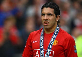 MANCHESTER, ENGLAND - MAY 16:  Carlos Tevez of Manchester United looks on after his side won the Premier League title at the end of the Barclays Premier League match between Manchester United and Arsenal at Old Trafford on May 16, 2009 in Manchester, England.  (Photo by Alex Livesey/Getty Images)