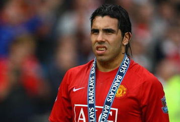MANCHESTER, ENGLAND - MAY 16:  Carlos Tevez of Manchester United looks on after his side won the Premier League title at the end of the Barclays Premier League match between Manchester United and Arsenal at Old Trafford on May 16, 2009 in Manchester, England.  (Photo by Alex Livesey/Getty Images)
