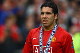 MANCHESTER, ENGLAND - MAY 16:  Carlos Tevez of Manchester United looks on after his side won the Premier League title at the end of the Barclays Premier League match between Manchester United and Arsenal at Old Trafford on May 16, 2009 in Manchester, England.  (Photo by Alex Livesey/Getty Images)