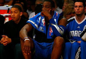 LOS ANGELES, CA - JUNE 04:  (L-R) Tyronn Lue #10, Dwight Howard #12 and J.J. Redick #7 of the Orlando Magic sit on the bench in the second half against the Los Angeles Lakers in Game One of the 2009 NBA Finals at Staples Center on June 4, 2009 in Los Angeles, California. NOTE TO USER: User expressly acknowledges and agrees that, by downloading and or using this photograph, User is consenting to the terms and conditions of the Getty Images License Agreement.  (Photo by Jeff Gross/Getty Images)