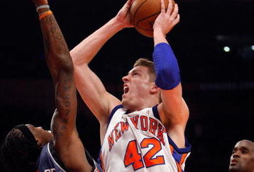 NEW YORK - MARCH 07:  David Lee #42 of the New York Knicks shoots the ball over Gerald Wallace #3 of the Charlotte Bobcats on March 7, 2009 at Madison Square Garden in New York City. NOTE TO USER: User expressly acknowledges and agrees that, by downloading and or using this photograph, User is consenting to the terms and conditions of the Getty Images License Agreement.  (Photo by Nick Laham/Getty Images)