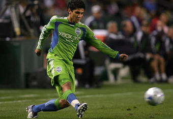 CARSON, CA - APRIL 18:  Fredy Montero #17 of Seattle Sounders FC crosses the ball during the MLS match against Chivas USA at The Home Depot Center on April 18, 2009 in Carson, California. Chivas USA defeated Sounders FC 2-0.  (Photo by Victor Decolongon/Getty Images)