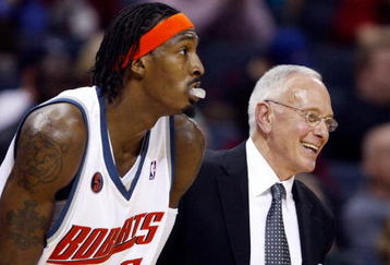 CHARLOTTE, NC - MARCH 16:  Head coach Larry Brown of the Charlotte Bobcats smiles as he stands with Gerald Wallace #3 during their game against the Toronto Raptors at Time Warner Cable Arena on March 16, 2009 in Charlotte, North Carolina.  NOTE TO USER: User expressly acknowledges and agrees that, by downloading and/or using this Photograph, user is consenting to the terms and conditions of the Getty Images License Agreement.  (Photo by Streeter Lecka/Getty Images)