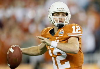 GLENDALE, AZ - JANUARY 05:  Quarterback Colt McCoy #12 of the Texas Longhorns drops back to pass during the Tostitos Fiesta Bowl Game against the Ohio State Buckeyes on January 5, 2009 at University of Phoenix Stadium in Glendale, Arizona.  (Photo by Jeff Gross/Getty Images)