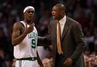 BOSTON - APRIL 30:  Rajon Rondo #9 and head coach Doc Rivers of the Boston Celtics talk near the sideline in Game Five of the Eastern Conference Quarterfinals against the Atlanta Hawks during the 2008 NBA Playoffs on April 30, 2008 at the TD Banknorth Garden in Boston, Massachusetts.  The Celtics won 110-85.  NOTE TO USER: User expressly acknowledges and agrees that, by downloading and or using this Photograph, user is consenting to the terms and conditions of the Getty Images License Agreement.  (Photo by Elsa/Getty Images)