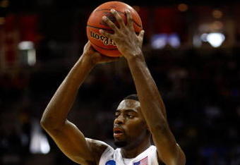 KANSAS CITY, MO - MARCH 21:  Tyreke Evans #12 of the Memphis Tigers looks to make a pass play during their second round game against the Maryland Terrapins in the NCAA Division I Men's Basketball Tournament at the Sprint Center on March 21, 2009 in Kansas City, Missouri. The Tigers defeated the Terrapins 89-70.  (Photo by Jamie Squire/Getty Images)