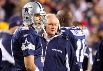 LANDOVER, MD - NOVEMBER 16:  Tony Romo #9 and head coach Wade Phillips of the Dallas Cowboys look on against the Washington Redskins during a time out on November 16, 2008 at FedEx Field in Landover, Maryland.  (Photo by Jim McIsaac/Getty Images)