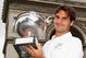 PARIS - JUNE 08:  Roger Federer of Switzerland poses with his French Open winners trophy at the Arc de Triomphe on June 8, 2009 in Paris, France.  (Photo by Ryan Pierse/Getty Images)