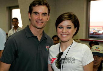 FONTANA, CA - SEPTEMBER 03:  Jeff Gordon, driver of the #24 DuPont Chevrolet, poses for a photograph with Singer Kelly Clarkson before the start of the NASCAR Nextel Cup Series Sony HD 500 on September 3, 2006 at California Speedway in Fontana, California.  (Photo by Todd Warshaw/Getty Images for NASCAR)